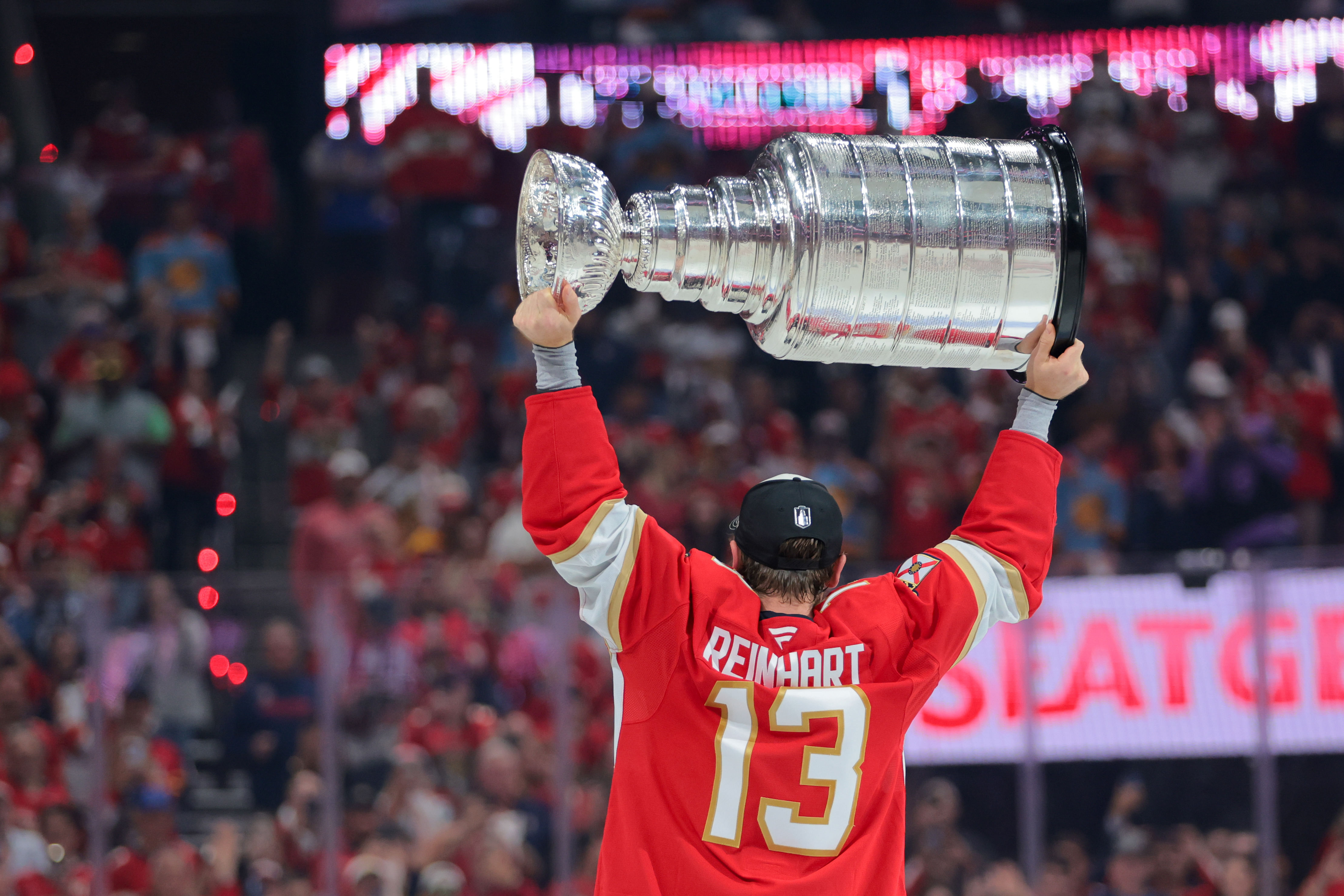 Sam Reinhart lifting the Stanley Cup (Imagn)